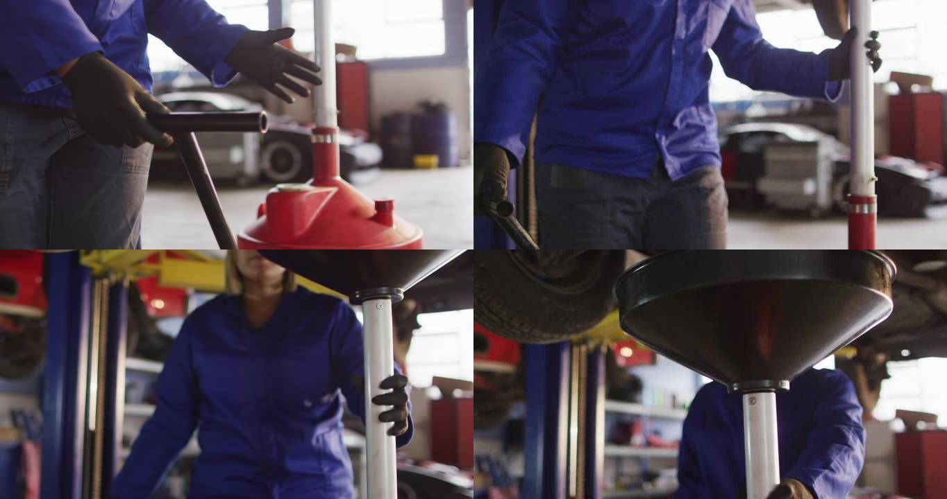 女机械师在汽车服务站将换油设备放置在汽车下方