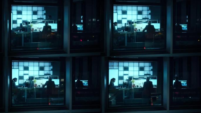 窗外的镜头: 资深商人坐在他办公室的台式电脑前。他正在研究深夜的金融股市预测和商业策略。