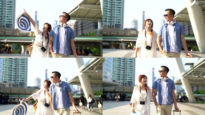 亚洲夫妇戴着墨镜出国旅游，在城市的暑假拍摄，约会和旅行的想法。