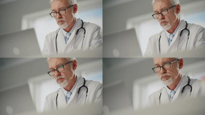 经验丰富的中年男医生穿着白大褂在办公室用笔记本电脑工作。高级医疗保健专业人员处理测试结果，病人治疗计
