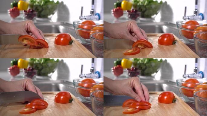 女人的手切番茄广告素食主义者备菜