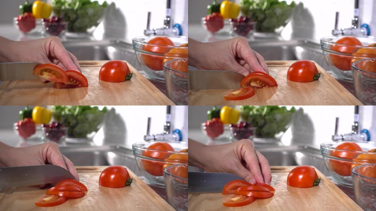 女人的手切番茄广告素食主义者备菜