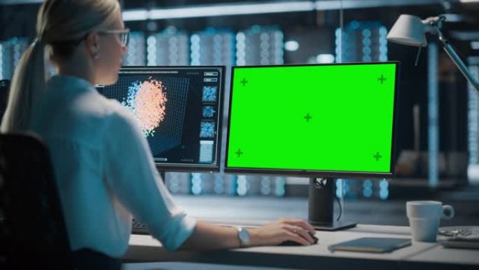 高科技数据中心服务器: 在绿屏色度关键计算机上工作的女性IT专家。监控网络服务、云计算、分析设施、维