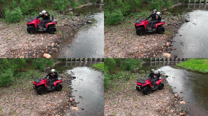 幸福夫妇在四轮摩托上接吻的天线