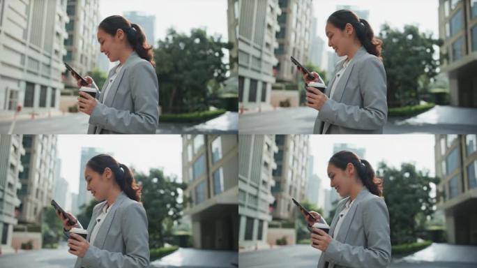 女商人在城市的城市街道上使用智能手机与人们在线连接，消息传递和浏览互联网