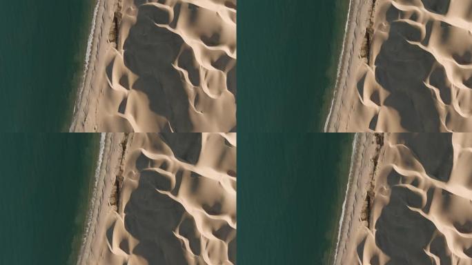 壮观的高鸟瞰图，无尽的沙丘在纳米布沙漠中与大西洋相遇