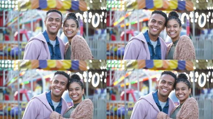 游乐园里的年轻黑人夫妇，对着镜头微笑