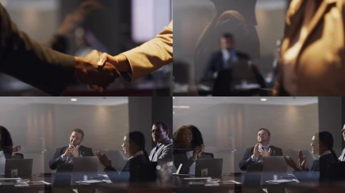 两名商人握手和同事在会议室鼓掌的4k录像