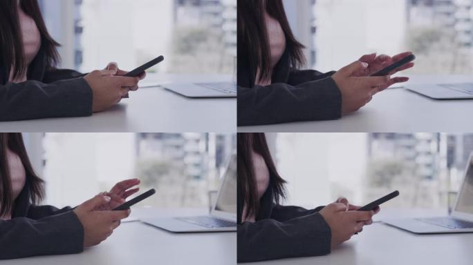 一名女商人在办公室的办公桌上使用智能手机的4k视频片段