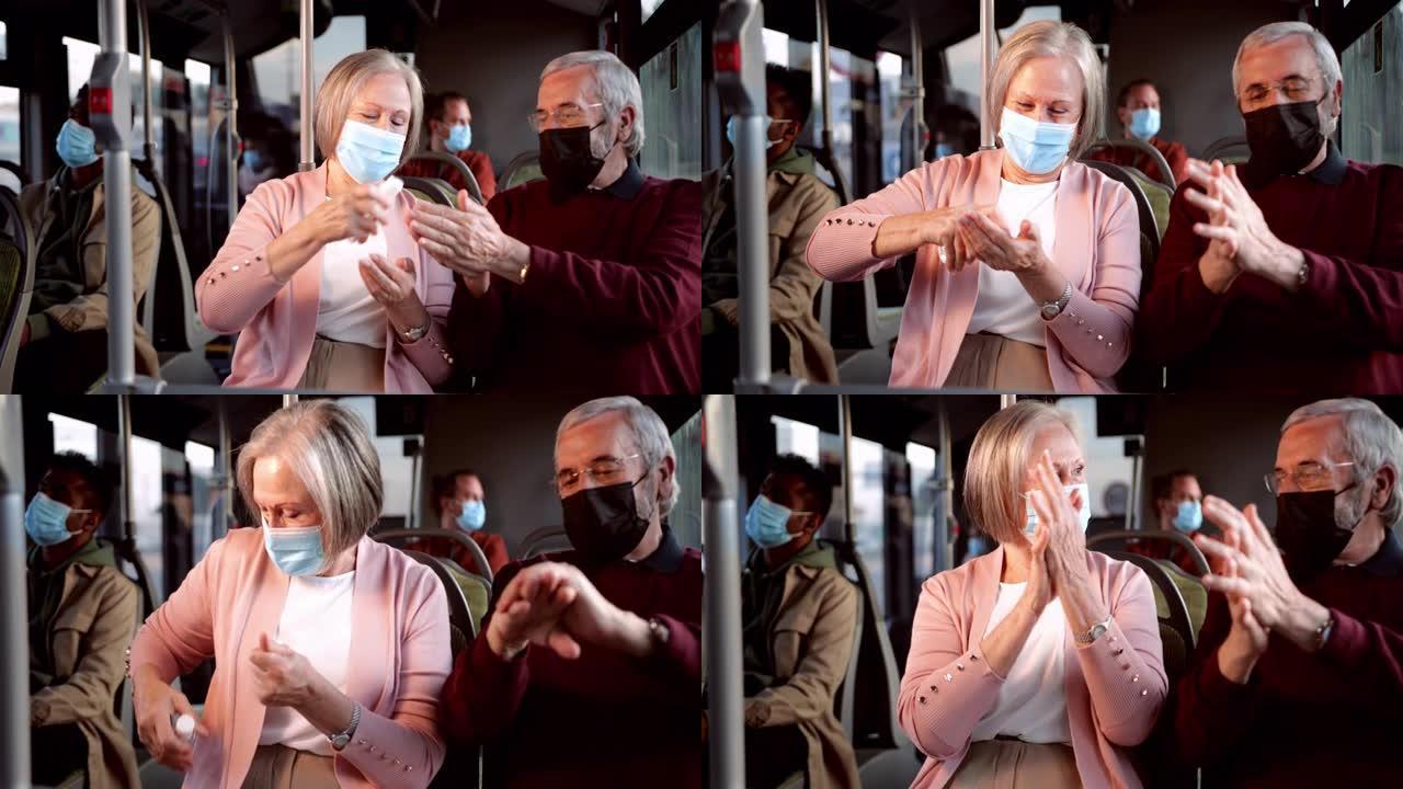 快乐的高级夫妇戴着covid口罩消毒公交车内的手