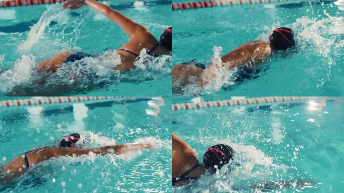 美丽的女游泳者使用前爬行，在游泳池自由泳。专业运动员训练赢得冠军。电影慢动作，颜色，时尚特写，高角度