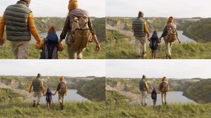 徒步旅行时享受风景的家庭
