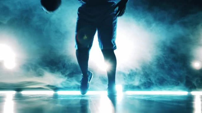 一名男球员的篮球训练在黑暗的房间里举行