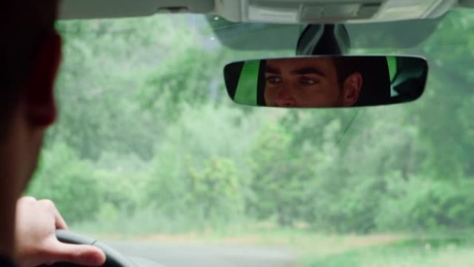 男子驾驶汽车开车画面后视镜方向盘