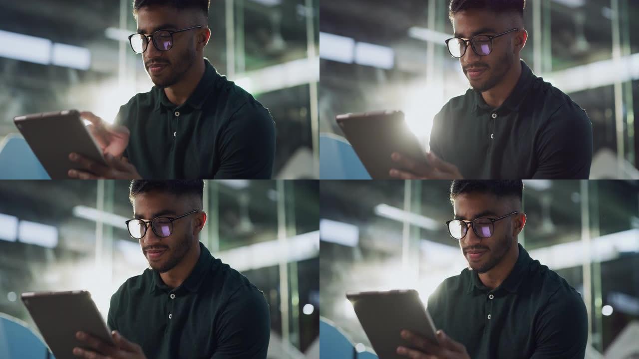 4k视频片段，一个英俊的年轻人独自坐在动物收容所中并使用数字平板电脑