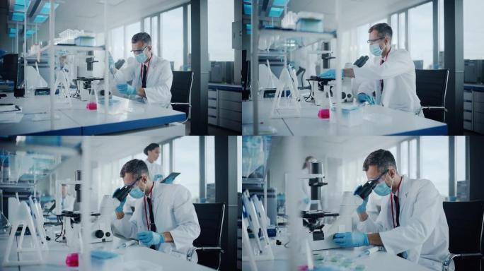 医学发展实验室: 科学家戴着口罩在显微镜下观察，将数据输入数字平板电脑。高级制药实验室从事医学、生物