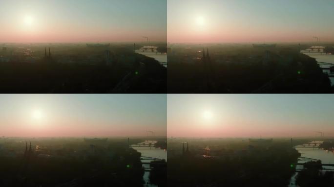 雄伟的空中全景，太阳升起在史诗般的大气雾蒙蒙的华沙城市景观，维斯拉河上的体育场和桥梁。