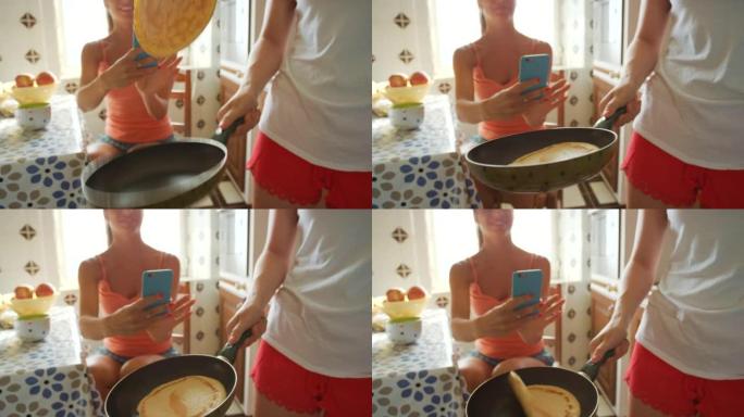 一个女人在她的朋友在手机上拍照时翻转煎饼