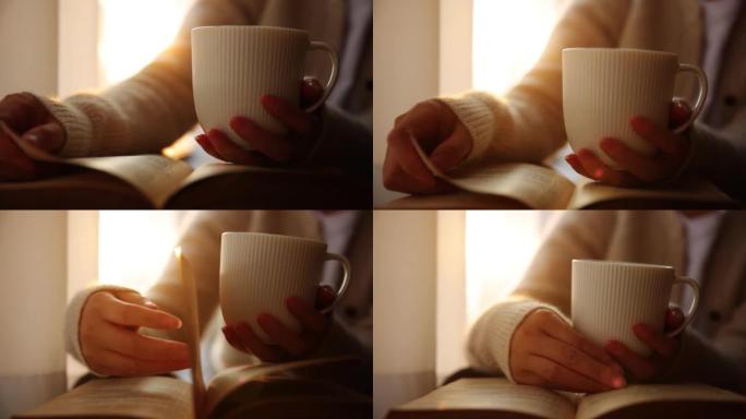 女人手握咖啡杯看书