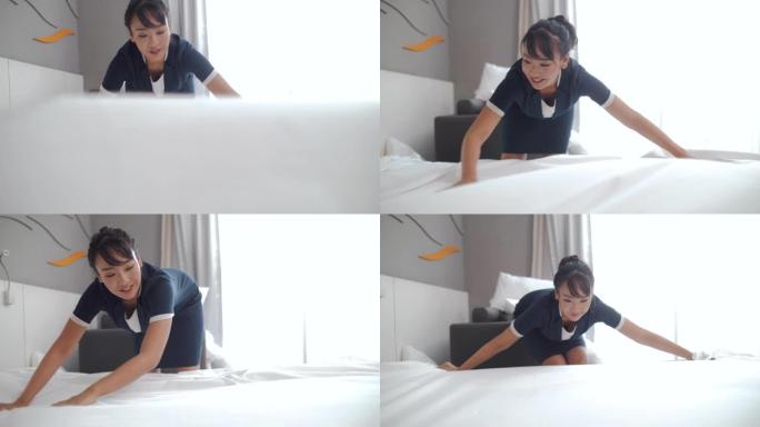 女管家在酒店房间铺床