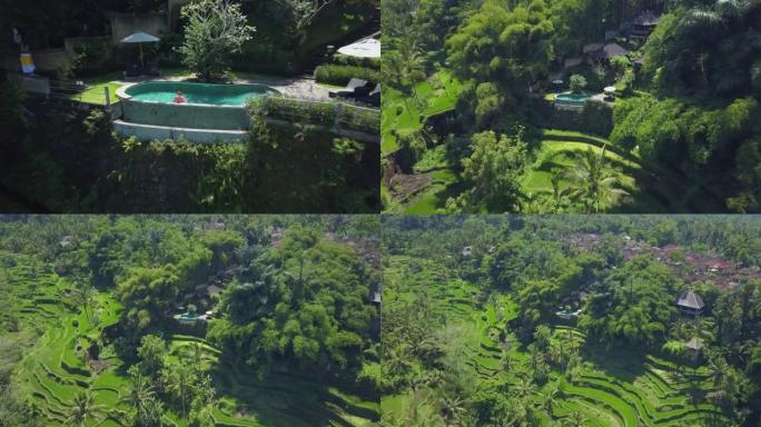 空中: 女游客从游泳池欣赏巴厘岛丛林的景色。