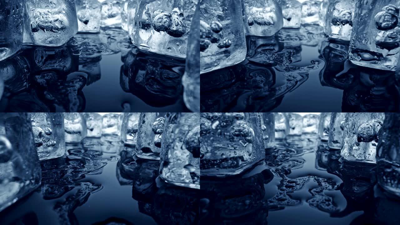 晶莹剔透的透明冰块闪耀着光芒。冰融化，覆盖着水滴。一些水洒了过来。抽象镜头，UHD