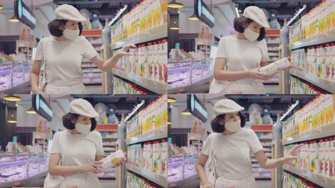 视频年轻女子戴着医用口罩的女孩在超市购买罐头食品