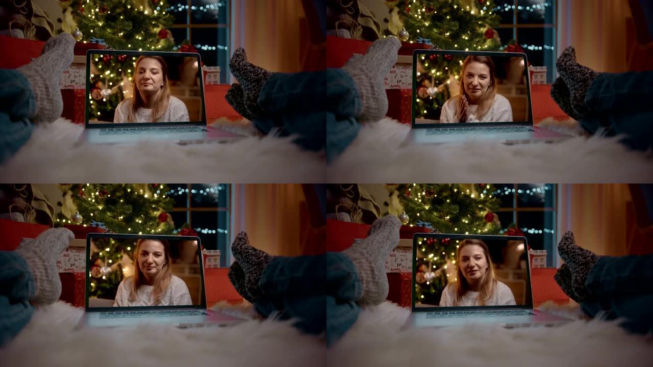 POV夫妇在圣诞节与一名妇女在笔记本电脑上进行视频通话