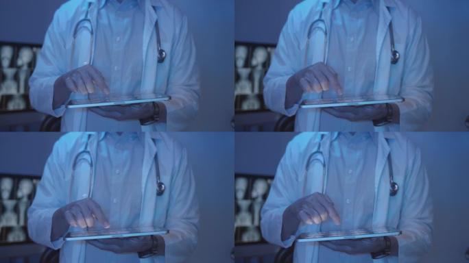 医生在数字平板电脑上检查患者的x射线图像，特写