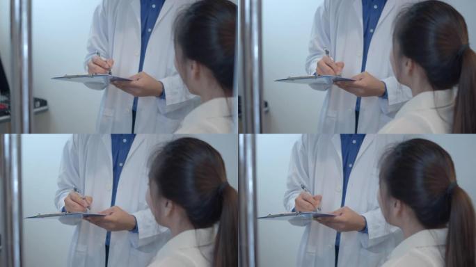 医生的手给女病人写了一份病历，特写