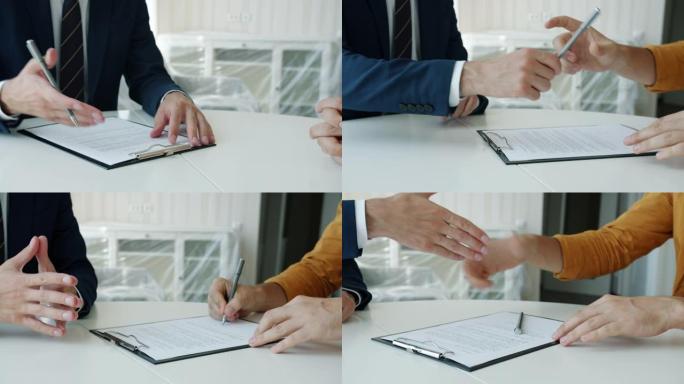 男性手签买卖协议特写与房产商在室内握手
