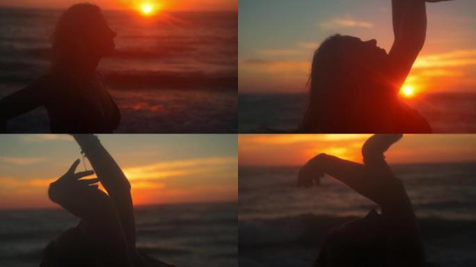年轻女子女士在日落时在海滩上跳舞