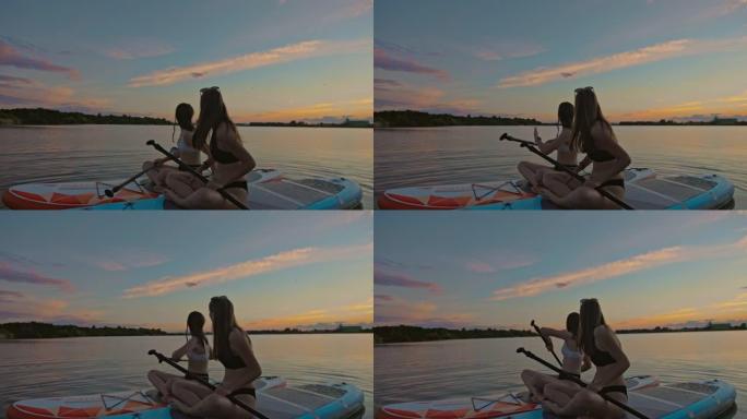 两名年轻女子在河上划独木舟时移开了目光