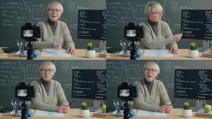 使用数码相机进行软件语言口语和显示计算机屏幕的女性IT专家录制教程