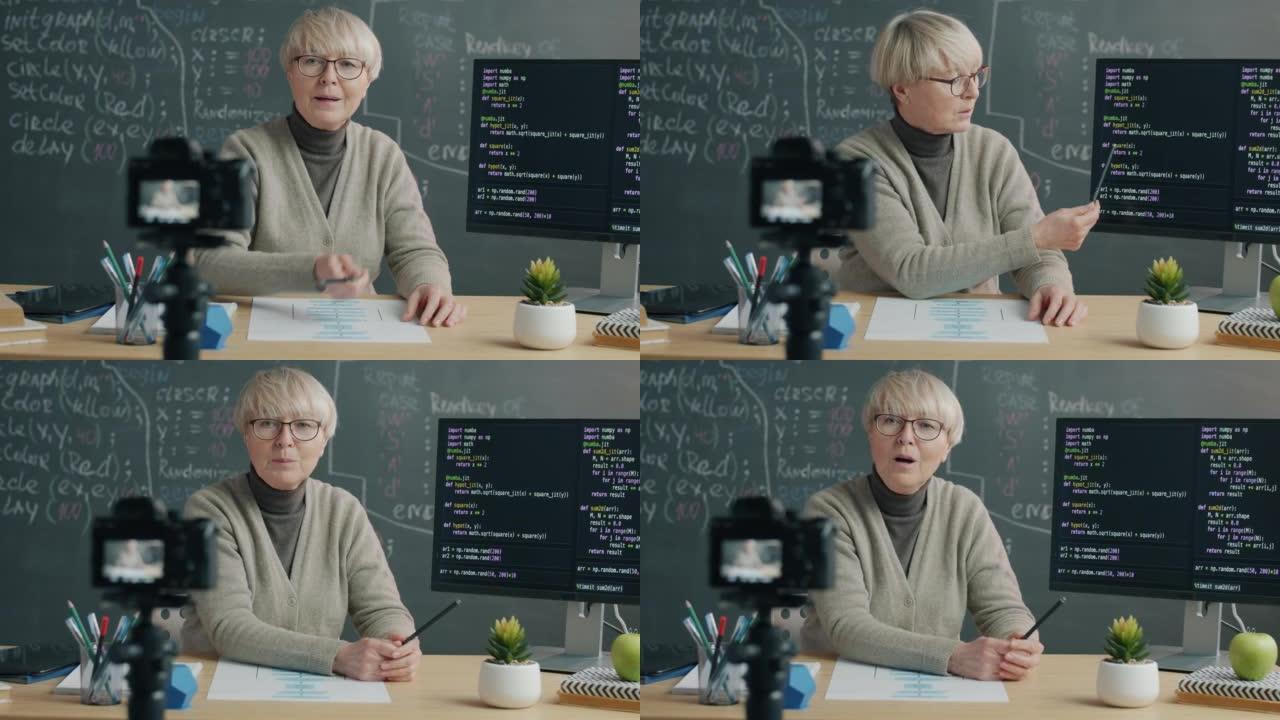 使用数码相机进行软件语言口语和显示计算机屏幕的女性IT专家录制教程