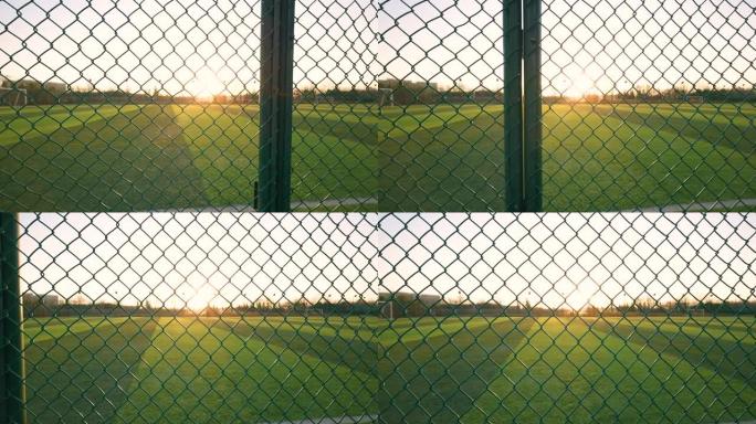 栅栏后面的足球场空镜头绿茵场球场