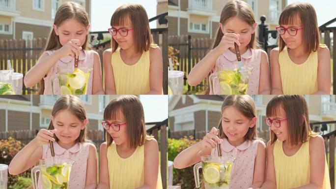 可爱的小女孩在户外做柠檬水
