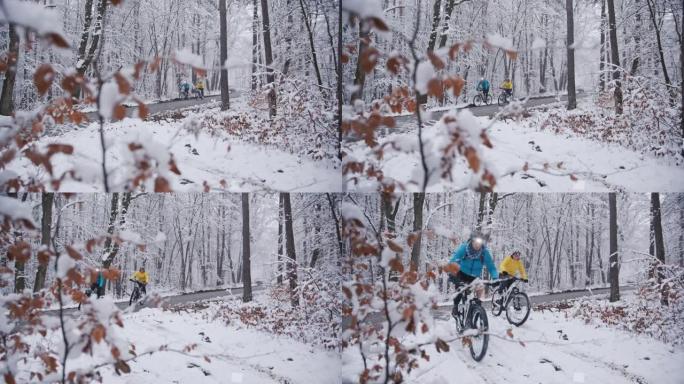 在下雪的冬季小径上与前灯骑行ebikes的情侣