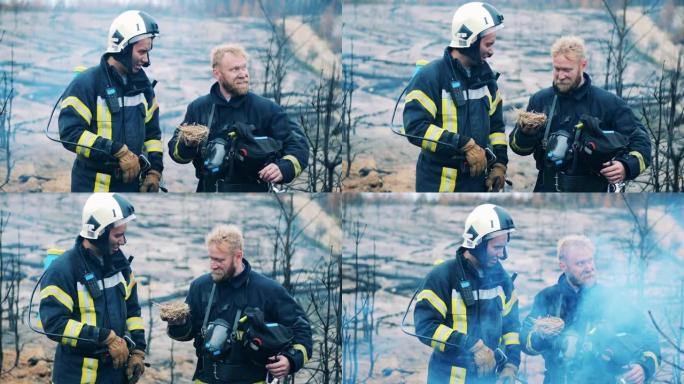 消防员抱着从大火中救出的巢穴