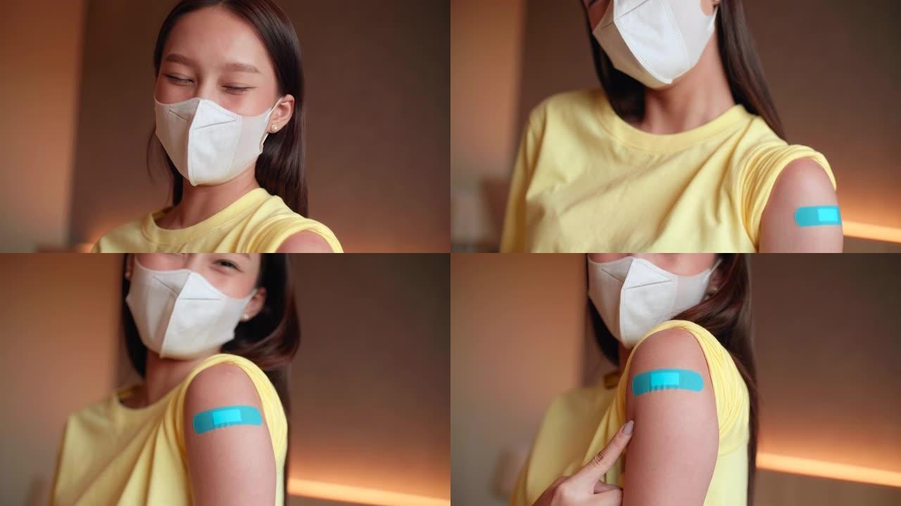 接种疫苗后，年轻女子在肩膀上露出绷带以表达