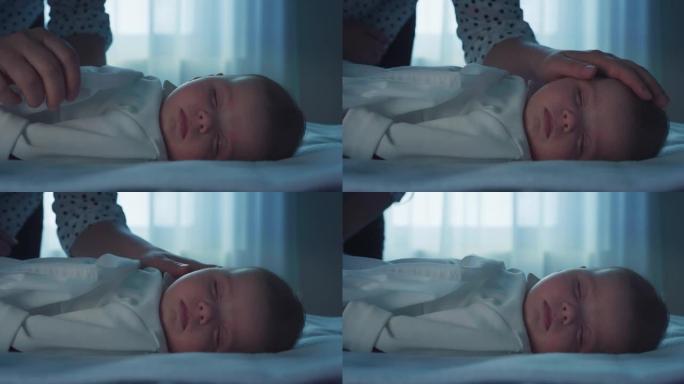 电影拍摄的新妈妈正在爱抚和亲吻她刚出生的婴儿，而晚上则在托儿所里用柔软的毯子在婴儿床里安然入睡，梦d