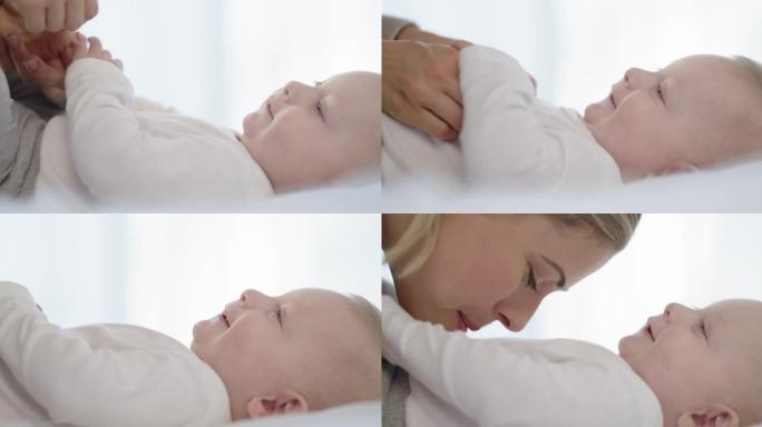4k视频片段，一名年轻女子与她的男婴在家中结为纽带