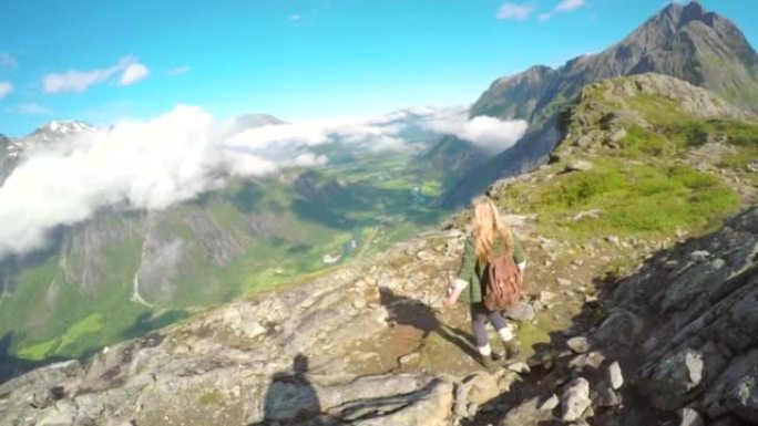 4k视频片段，一位迷人的年轻女子徒步穿越挪威的山脉