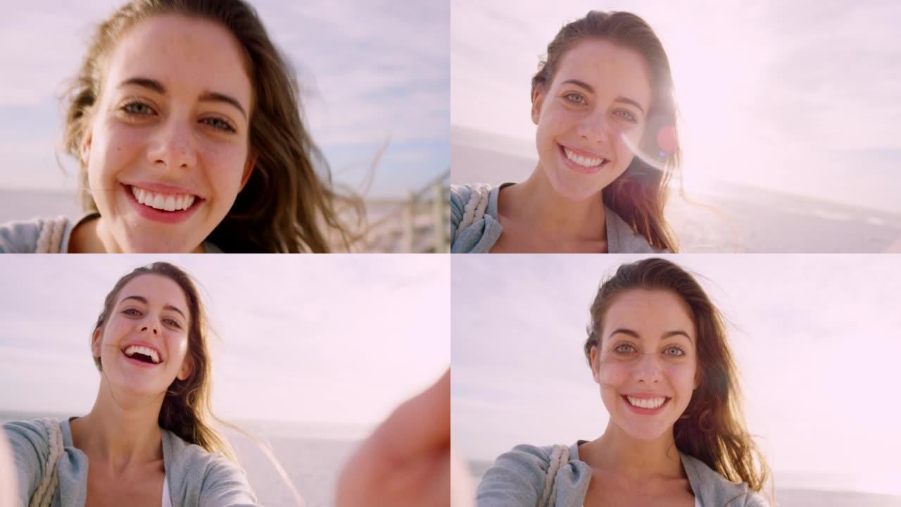 4k视频片段，一名年轻女子在海滩上进行视频通话