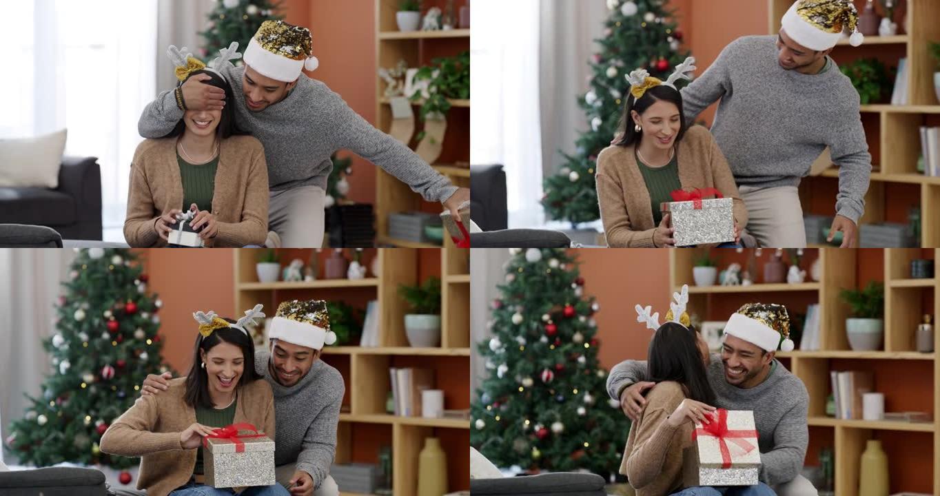 一对年轻夫妇在家里休息室交换圣诞礼物的4k视频片段