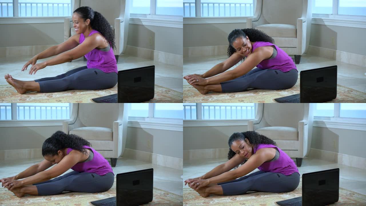 女人在网上上课在家锻炼，伸展运动