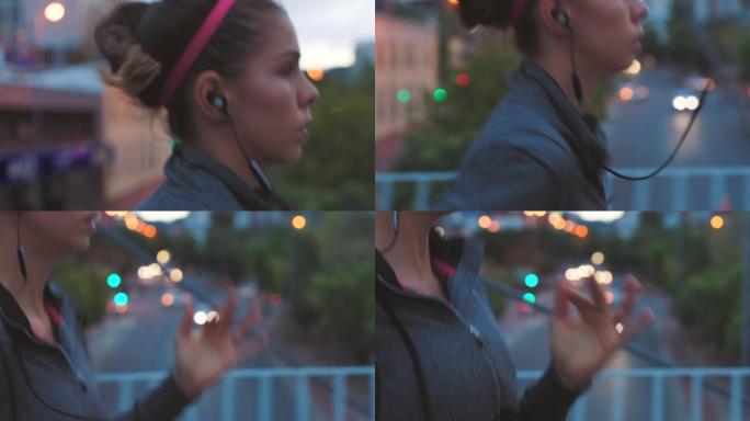 适合晚上在户外城市跑步和慢跑的女人。一个认真的年轻运动员在做有氧运动时听音乐的特写镜头。锻炼以改善健