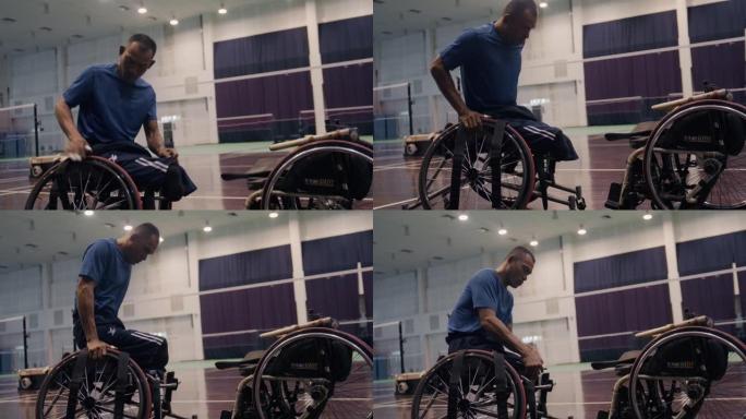 坐在轮椅上的亚洲残疾人在去羽毛球场之前穿上制服并检查安全。