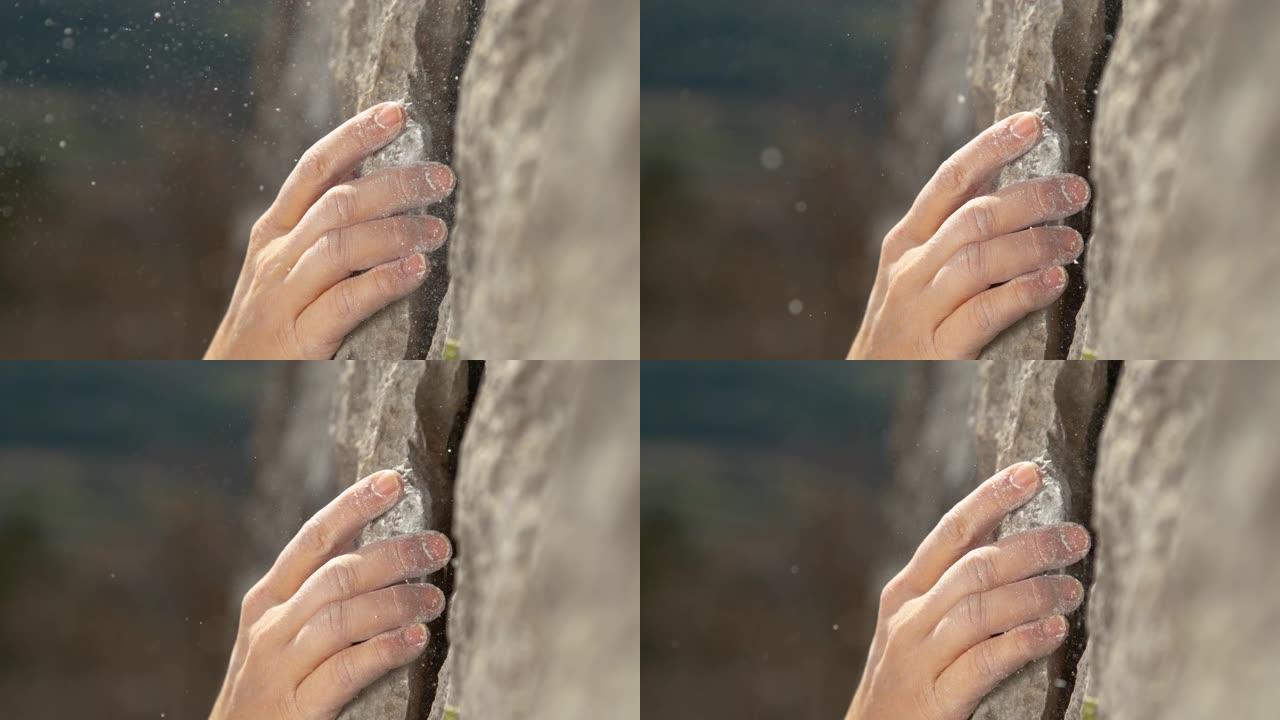 宏观: 攀岩者攀登悬崖时，白色镁粉在空中飞舞。