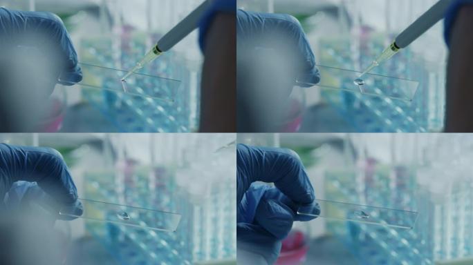使用微量移液器关闭一名戴着手套的科学家的宏观镜头，并将白色化学液体倒在显微镜样品板上。用技术设备在实